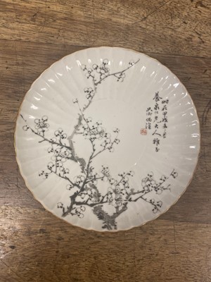 Lot 216 - A PAIR OF CHINESE EN GRISAILLE-DECORATED 'PRUNUS' DISHES.