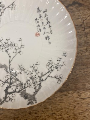 Lot 216 - A PAIR OF CHINESE EN GRISAILLE-DECORATED 'PRUNUS' DISHES.