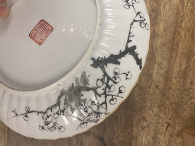 Lot 216 - A PAIR OF CHINESE EN GRISAILLE-DECORATED 'PRUNUS' DISHES.