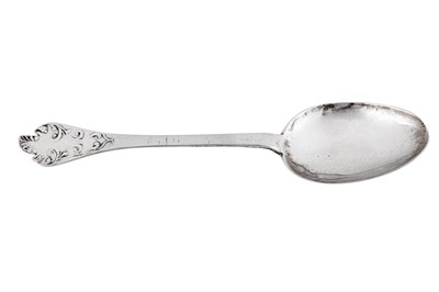 Lot 495 - A Queen Anne provincial West Country Britannia standard silver ‘lace back’ trifid spoon, Exeter 1707 by Edward Sweet of Dunster (b.1673-c.1737)