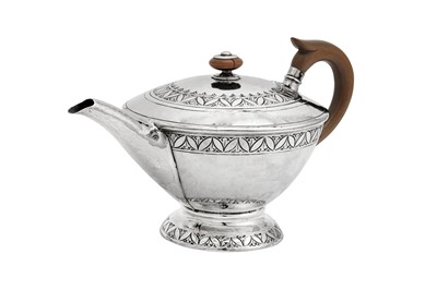 Lot 506 - A George V ‘Arts and Crafts’ sterling silver teapot, Birmingham 1913 by William Hair Haseler