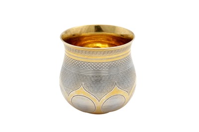 Lot 385 - An Alexander II mid-19th century Russian 84 zolotnik parcel gilt silver vodka cup (charka), Moscow 1864 by П.A. (unidentified active 1860-65 Postnikova 2774)