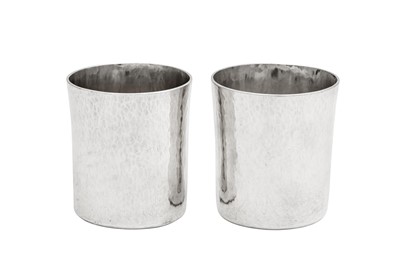 Lot 521 - A pair of Elizabeth II hand crafted Britannia standard silver beakers, London 1970 by Ronald Napier & Robert Grant