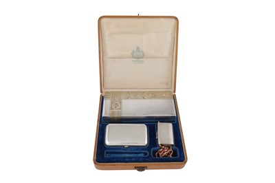 Lot 382 - A cased Nicholas II late 19th century Russian 84 zolotnik silver smoker’s compendium set, the cigar box, Saint Petersburg 1888 by Johan Ferdinand Olsonius for Grachev Brothers