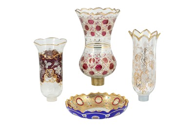 Lot 133 - THREE WHEEL-CUT, DIAMOND-CUT AND GILT GLASS LAMP COVERS AND A DISH