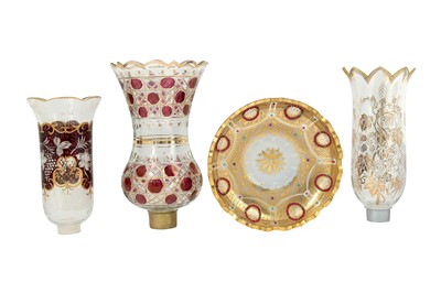 Lot 133 - THREE WHEEL-CUT, DIAMOND-CUT AND GILT GLASS LAMP COVERS AND A DISH