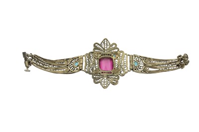 Lot 166 - A LOW-GRADE SILVER FILIGREE BRACELET SET WITH A LARGE EMERALD-CUT SYNTHETIC RUBY