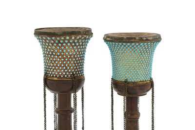 Lot 148 - TWO TURQUOISE-INSET GILT COPPER QALYAN CUPS WITH WOODEN STEMS