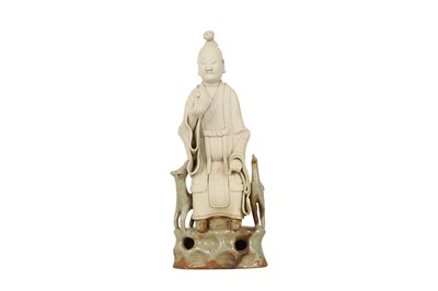 Lot 879 - A CHINESE PART-GLAZED BISCUIT FIGURE OF AN IMMORTAL.