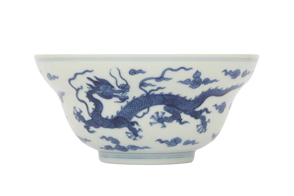 Lot 85 - A CHINESE BLUE AND WHITE OGEE 'DRAGON' BOWL.