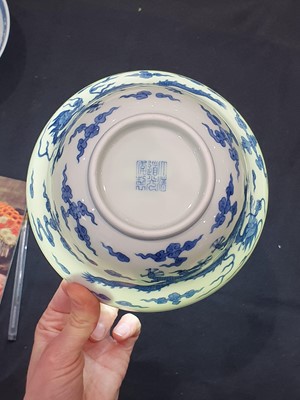 Lot 85 - A CHINESE BLUE AND WHITE OGEE 'DRAGON' BOWL.