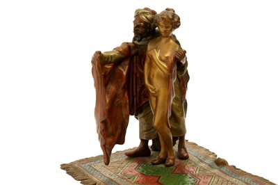 Lot 683 - A COLD-PAINTED EROTIC BRONZE FIGURE OF A SLAVE TRADER BY FRANZ XAVIER BERGMAN (1861 - 1936)