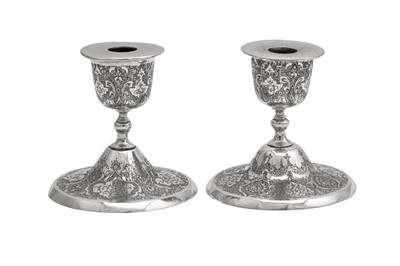 Lot 306 - A pair of mid-20th century Iranian (Persian) silver dwarf candlesticks, Isfahan circa 1950 mark of Kazem