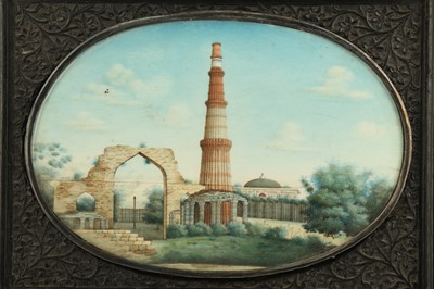 Lot 370 - λ A LARGE OVAL IVORY MINIATURE OF THE QUTB MINAR COMPLEX IN DELHI