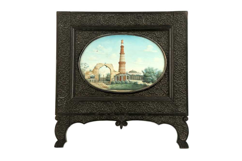 Lot 370 - λ A LARGE OVAL IVORY MINIATURE OF THE QUTB MINAR COMPLEX IN DELHI