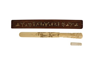 Lot 913 - λ A JAPANESE LETTER OPENER, AN IVORY SEAL AND A CHINESE NINGBO IVORY AND SATINWOOD PANEL.