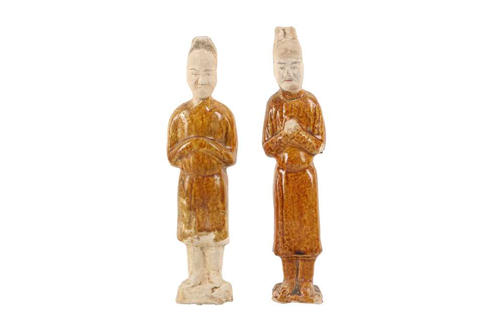 Lot 880 - TWO CHINESE GLAZED POTTERY FIGURES OF OFFICIALS.