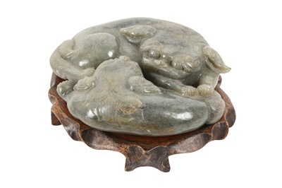 Lot 629 - A CHINESE CELADON JADE CARVING OF TWO LION DOGS.