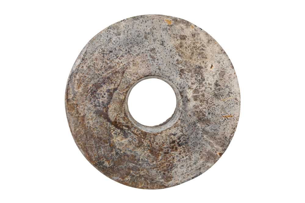 Lot 351 - A CHINESE JADE BI DISK.