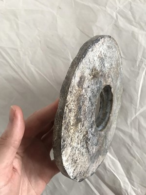 Lot 351 - A CHINESE JADE BI DISK.