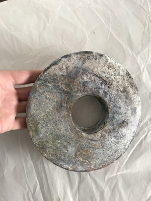 Lot 351 - A CHINESE JADE BI DISK.