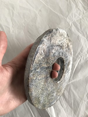 Lot 351 - A CHINESE JADE BI DISK.