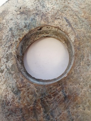 Lot 351 - A CHINESE JADE BI DISK.