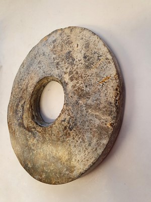 Lot 351 - A CHINESE JADE BI DISK.