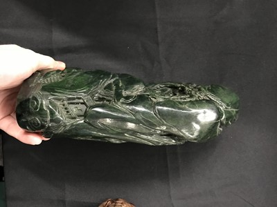 Lot 101 - A CHINESE SPINACH-GREEN JADE 'MOUNTAIN' BOULDER.