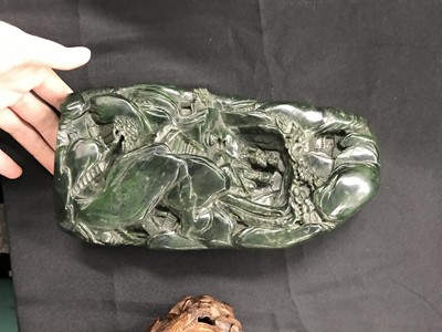 Lot 101 - A CHINESE SPINACH-GREEN JADE 'MOUNTAIN' BOULDER.
