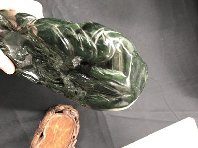 Lot 624 - A CHINESE SPINACH-GREEN JADE 'MOUNTAIN' BOULDER.