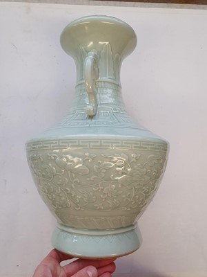 Lot 189 - A CHINESE PALE CELADON-GLAZED 'PEONIES' VASE.
