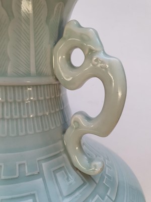 Lot 189 - A CHINESE PALE CELADON-GLAZED 'PEONIES' VASE.