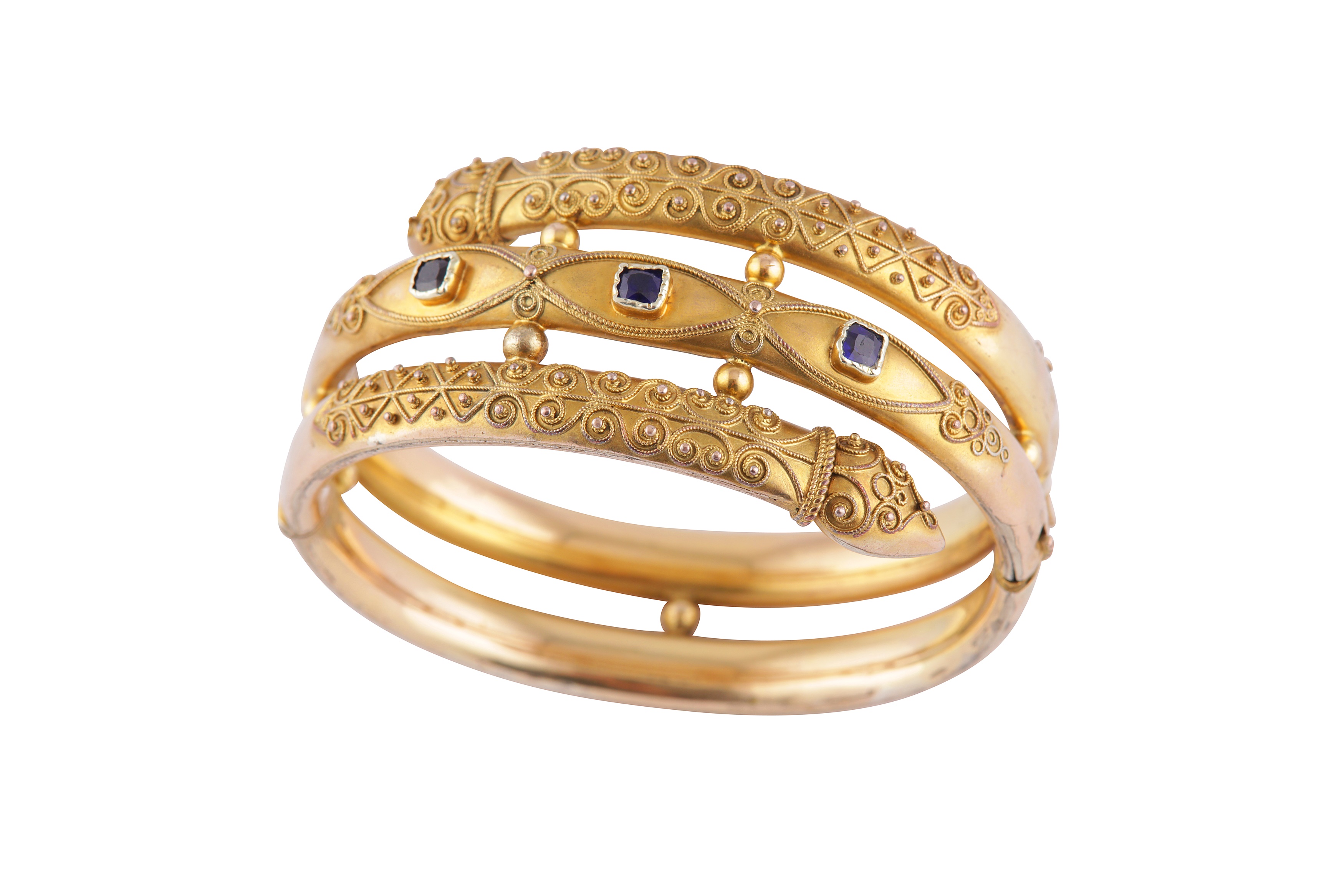 Lot 10 - AN ARCHAEOLOGICAL STYLE BANGLE