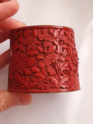 Lot 636 - A PAIR OF CHINESE CINNABAR RED LACQUER WRIST BANDS.