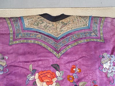 Lot 295 - A CHINESE EMBROIDERED PURPLE-GROUND LADY'S SILK JACKET.