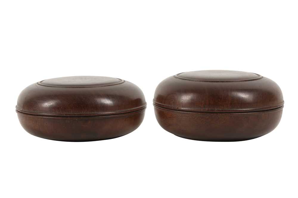 Lot 513 - A PAIR OF CHINESE HARDWOOD CIRCULAR BOXES AND COVERS.