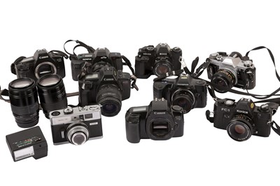 Lot 260 - A Canon AE-1 with 28mm Lens & Other SLR Cameras.