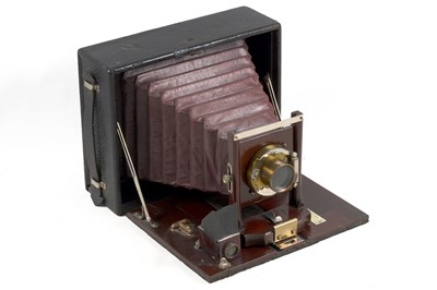 Lot 99 - Three Folding Maroon Bellows Cameras.