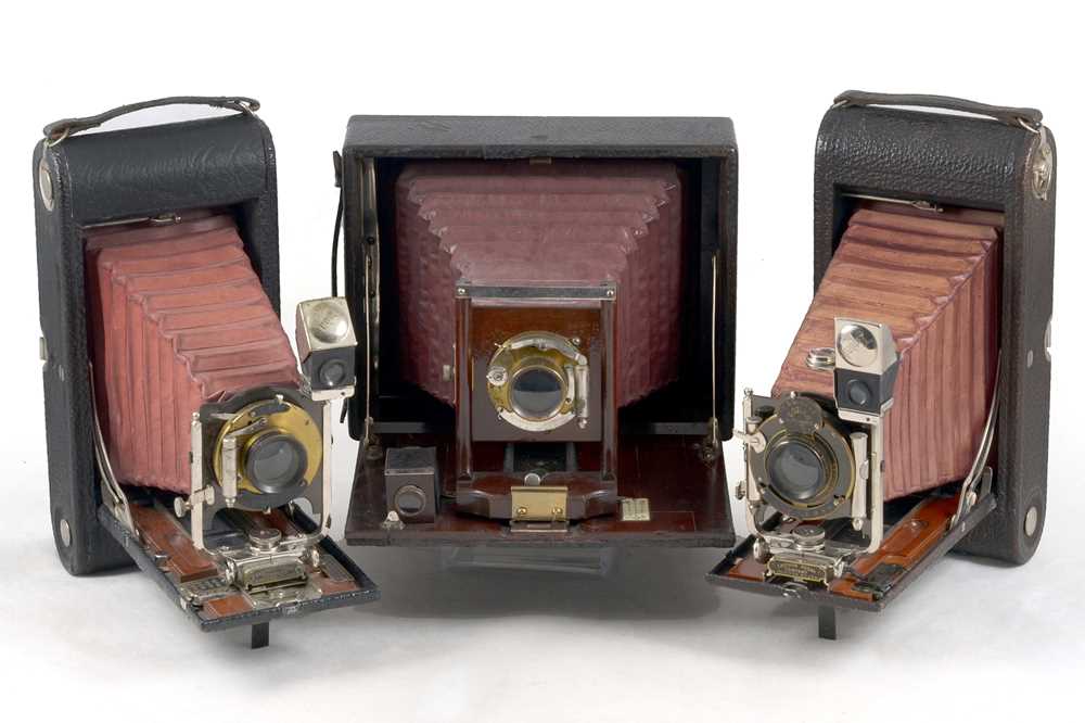 Lot 99 - Three Folding Maroon Bellows Cameras.