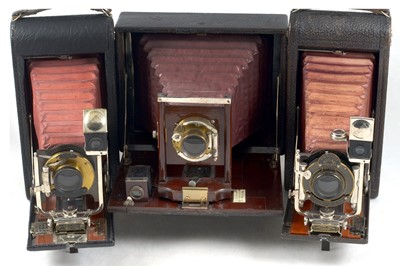 Lot 99 - Three Folding Maroon Bellows Cameras.