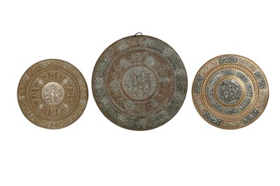 Lot 1072 - THREE COPPER AND SILVER-INLAID TANJORE TRAYS