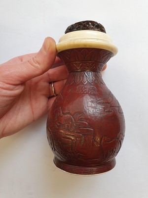 Lot 165 - λ A CHINESE MOULDED GOURD 'EIGHT HORSES OF WANG MU' CRICKET CAGE.