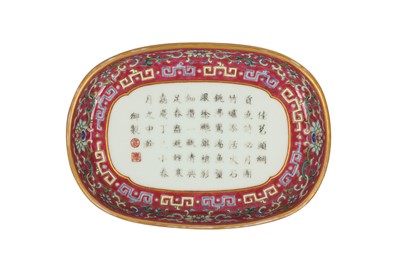 Lot 875 - A CHINESE FAMILLE ROSE OVAL RUBY-GROUND TRAY.