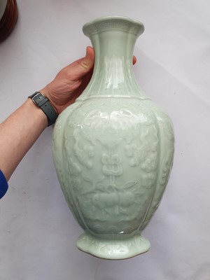 Lot 190 - A CHINESE CELADON-GLAZED 'BATS AND PEACHES' VASE.