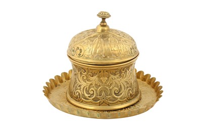 Lot 521 - AN ENGRAVED AND REPOUSSÉ GILT COPPER (TOMBAC) LIDDED JAR AND TRAY