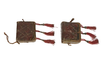 Lot 428 - TWO OTTOMAN TOOLED LEATHER CARTRIDGE CASES WITH TASSELS