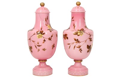 Lot 655 - A PAIR OF BACCARAT-STYLE PINK AND WHITE OPALINE GLASS LIDDED VASES PAINTED WITH GOL-O-BOLBOL MOTIF