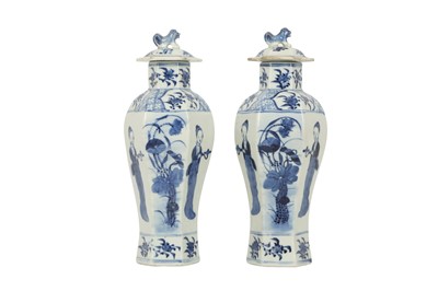 Lot 617 - A PAIR OF CHINESE BLUE AND WHITE HEXAGONAL BALUSTER VASES AND COVERS.