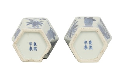 Lot 617 - A PAIR OF CHINESE BLUE AND WHITE HEXAGONAL BALUSTER VASES AND COVERS.